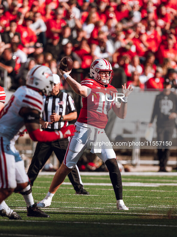 Wisconsin Badgers quarterback Tyler Van Dyke #10 throws a pass against the South Dakota Coyotes at Camp Randall Stadium in Madison, Wisconsi...