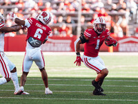 Wisconsin Badgers running back Chez Mellusi #1 takes a screen pass against the South Dakota Coyotes defense at Camp Randall Stadium in Madis...