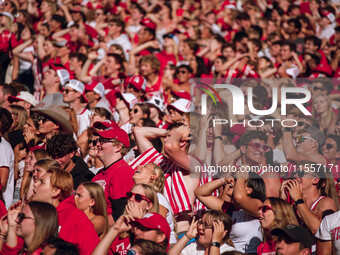 Fans look at the scoreboard in disbelief at Camp Randall Stadium in Madison, Wisconsin, on September 7, 2024. (