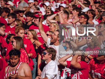 Fans look at the scoreboard in disbelief at Camp Randall Stadium in Madison, Wisconsin, on September 7, 2024. (