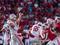 South Dakota quarterback Aidan Bouman #2 attempts a pass against the Wisconsin Badgers at Camp Randall Stadium in Madison, Wisconsin, on Sep...