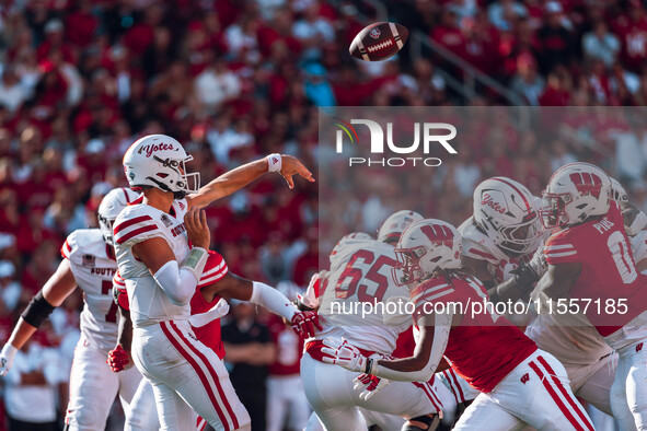 South Dakota quarterback Aidan Bouman #2 attempts a pass against the Wisconsin Badgers at Camp Randall Stadium in Madison, Wisconsin, on Sep...