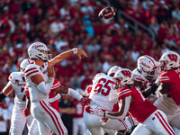 South Dakota quarterback Aidan Bouman #2 attempts a pass against the Wisconsin Badgers at Camp Randall Stadium in Madison, Wisconsin, on Sep...