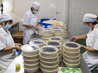 Workers pack mooncakes at a workshop of Oriental Pastry Co., LTD., a time-honored pastry company in Taizhou, China, on September 8, 2024. (