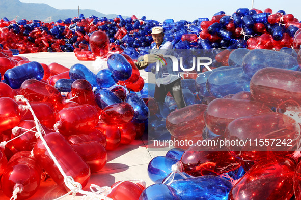 Fishermen prepare floats for shipment in Lianyungang, China, on September 8, 2024. 