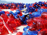 Fishermen prepare floats for shipment in Lianyungang, China, on September 8, 2024. (