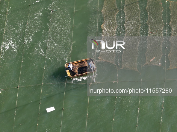 Fishermen drive various kinds of aquaculture boats in the coastal aquaculture zone in Lianyungang, China, on September 8, 2024. 