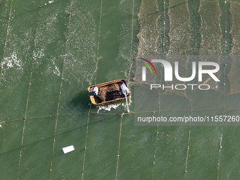 Fishermen drive various kinds of aquaculture boats in the coastal aquaculture zone in Lianyungang, China, on September 8, 2024. (