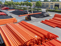 A worker produces pipes at a production workshop in Suqian, China, on September 8, 2024. (