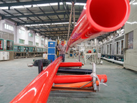 A worker produces pipes at a production workshop in Suqian, China, on September 8, 2024. (