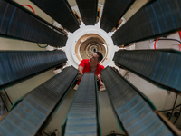 A worker produces pipes at a production workshop in Suqian, China, on September 8, 2024. (