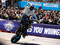 Aaron Colton performs motorcycle tricks during a Red Bull Showrun in Houston, Texas, on September 7, 2024. (