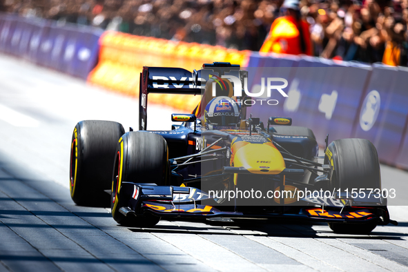 David Coulthard drives an RB8 through downtown Houston, Texas, on September 7, 2024. 