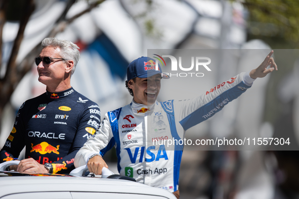 David Coulthard and Arvid Lindblad ride through downtown Houston, Texas, on September 7, 2024, and wave to fans ahead of Red Bull's Showrun....