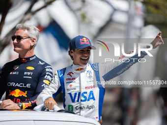 David Coulthard and Arvid Lindblad ride through downtown Houston, Texas, on September 7, 2024, and wave to fans ahead of Red Bull's Showrun....