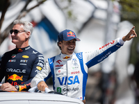 David Coulthard and Arvid Lindblad ride through downtown Houston, Texas, on September 7, 2024, and wave to fans ahead of Red Bull's Showrun....