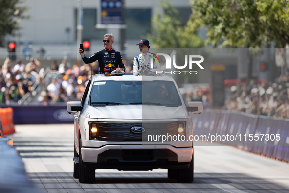 David Coulthard and Arvid Lindblad ride through downtown Houston, Texas, on September 7, 2024, and wave to fans ahead of Red Bull's Showrun....