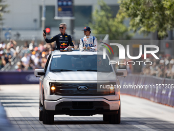 David Coulthard and Arvid Lindblad ride through downtown Houston, Texas, on September 7, 2024, and wave to fans ahead of Red Bull's Showrun....