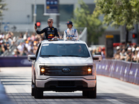 David Coulthard and Arvid Lindblad ride through downtown Houston, Texas, on September 7, 2024, and wave to fans ahead of Red Bull's Showrun....