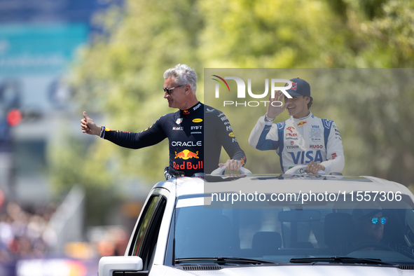 David Coulthard and Arvid Lindblad ride through downtown Houston, Texas, on September 7, 2024, and wave to fans ahead of Red Bull's Showrun....