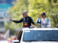 David Coulthard and Arvid Lindblad ride through downtown Houston, Texas, on September 7, 2024, and wave to fans ahead of Red Bull's Showrun....