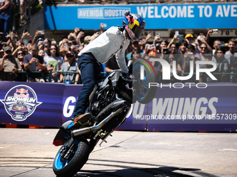 Aaron Colton performs motorcycle tricks during a Red Bull Showrun in Houston, Texas, on September 7, 2024. (