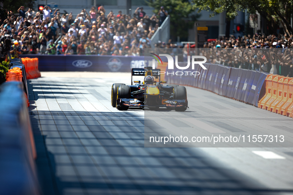 David Coulthard drives an RB8 through downtown Houston, Texas, on September 7, 2024. 