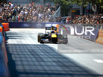 David Coulthard drives an RB8 through downtown Houston, Texas, on September 7, 2024. (