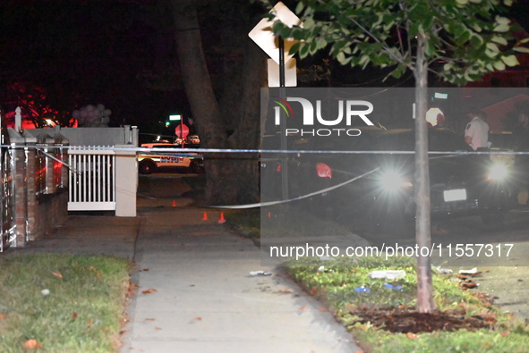 Police presence at the crime scene where three people are shot at 132-45 220th Street in Jamaica, Queens, New York, United States, on Septem...