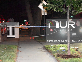 Police presence at the crime scene where three people are shot at 132-45 220th Street in Jamaica, Queens, New York, United States, on Septem...