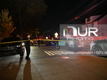 Police presence at the crime scene where three people are shot at 132-45 220th Street in Jamaica, Queens, New York, United States, on Septem...