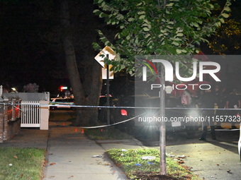 Police presence at the crime scene where three people are shot at 132-45 220th Street in Jamaica, Queens, New York, United States, on Septem...