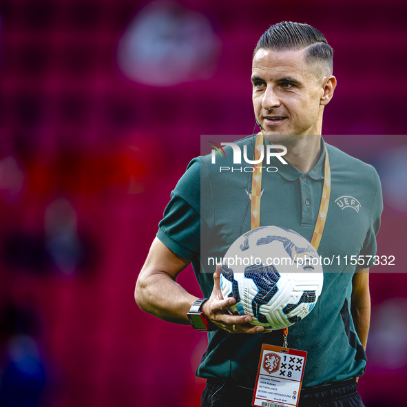 Referee Donatas Rumsas officiates the match between the Netherlands and Bosnia and Herzegovina at the Philips Stadium for the UEFA Nations L...