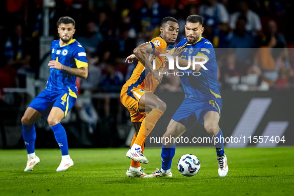 Netherlands midfielder Ryan Gravenberch and Bosnia and Herzegovina defender Adrian Leon Barisic during the match between the Netherlands and...