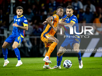 Netherlands midfielder Ryan Gravenberch and Bosnia and Herzegovina defender Adrian Leon Barisic during the match between the Netherlands and...