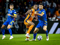 Netherlands midfielder Ryan Gravenberch and Bosnia and Herzegovina defender Adrian Leon Barisic during the match between the Netherlands and...