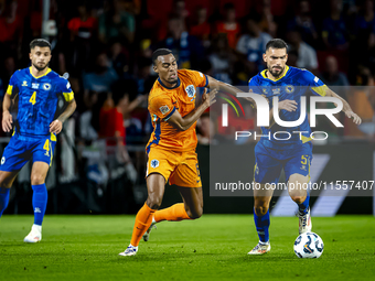 Netherlands midfielder Ryan Gravenberch and Bosnia and Herzegovina defender Adrian Leon Barisic during the match between the Netherlands and...