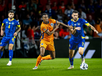 Netherlands midfielder Ryan Gravenberch and Bosnia and Herzegovina defender Adrian Leon Barisic during the match between the Netherlands and...