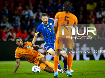 Netherlands midfielder Ryan Gravenberch and Bosnia and Herzegovina defender Adrian Leon Barisic during the match between the Netherlands and...