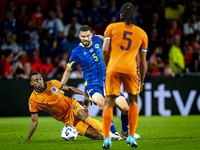 Netherlands midfielder Ryan Gravenberch and Bosnia and Herzegovina defender Adrian Leon Barisic during the match between the Netherlands and...