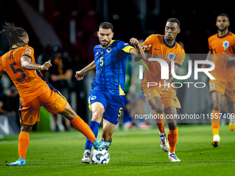 Netherlands midfielder Ryan Gravenberch and Bosnia and Herzegovina defender Adrian Leon Barisic during the match between the Netherlands and...