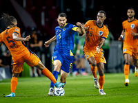 Netherlands midfielder Ryan Gravenberch and Bosnia and Herzegovina defender Adrian Leon Barisic during the match between the Netherlands and...