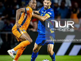 Netherlands midfielder Ryan Gravenberch and Bosnia and Herzegovina defender Adrian Leon Barisic during the match between the Netherlands and...