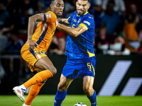 Netherlands midfielder Ryan Gravenberch and Bosnia and Herzegovina defender Adrian Leon Barisic during the match between the Netherlands and...