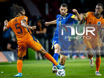 Netherlands midfielder Ryan Gravenberch and Bosnia and Herzegovina defender Adrian Leon Barisic during the match between the Netherlands and...