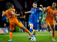 Netherlands midfielder Ryan Gravenberch and Bosnia and Herzegovina defender Adrian Leon Barisic during the match between the Netherlands and...