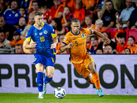 Bosnia and Herzegovina forward Ermedin Demirovic and Netherlands defender Nathan Ake during the match between the Netherlands and Bosnia and...