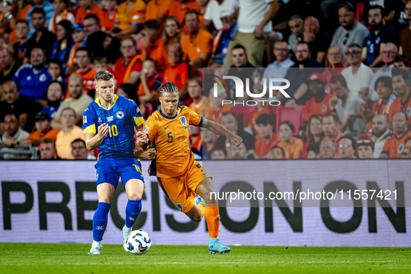 Bosnia and Herzegovina forward Ermedin Demirovic and Netherlands defender Nathan Ake during the match between the Netherlands and Bosnia and...