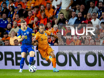 Bosnia and Herzegovina forward Ermedin Demirovic and Netherlands defender Nathan Ake during the match between the Netherlands and Bosnia and...