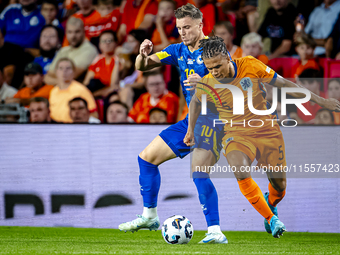 Bosnia and Herzegovina forward Ermedin Demirovic and Netherlands defender Nathan Ake during the match between the Netherlands and Bosnia and...